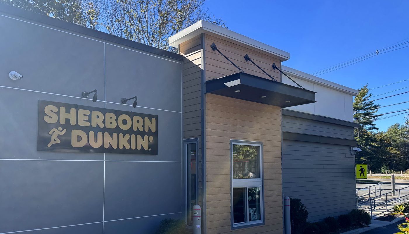 The Sherborn Dunkin’ building, with its “Sherborn Dunkin’” sign and drive-thru window
