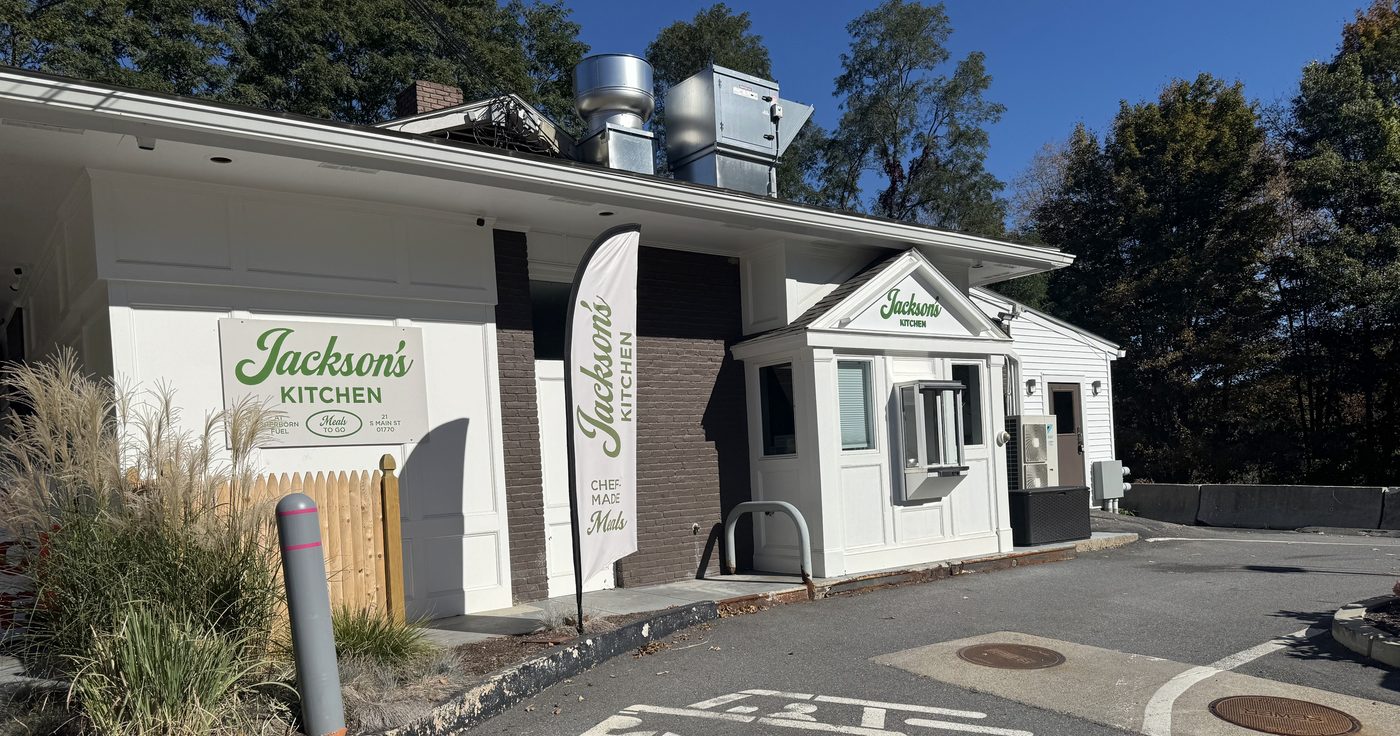 Jackson’s Kitchen at Sherborn Market, with its sign, banner, and walk-up pickup window