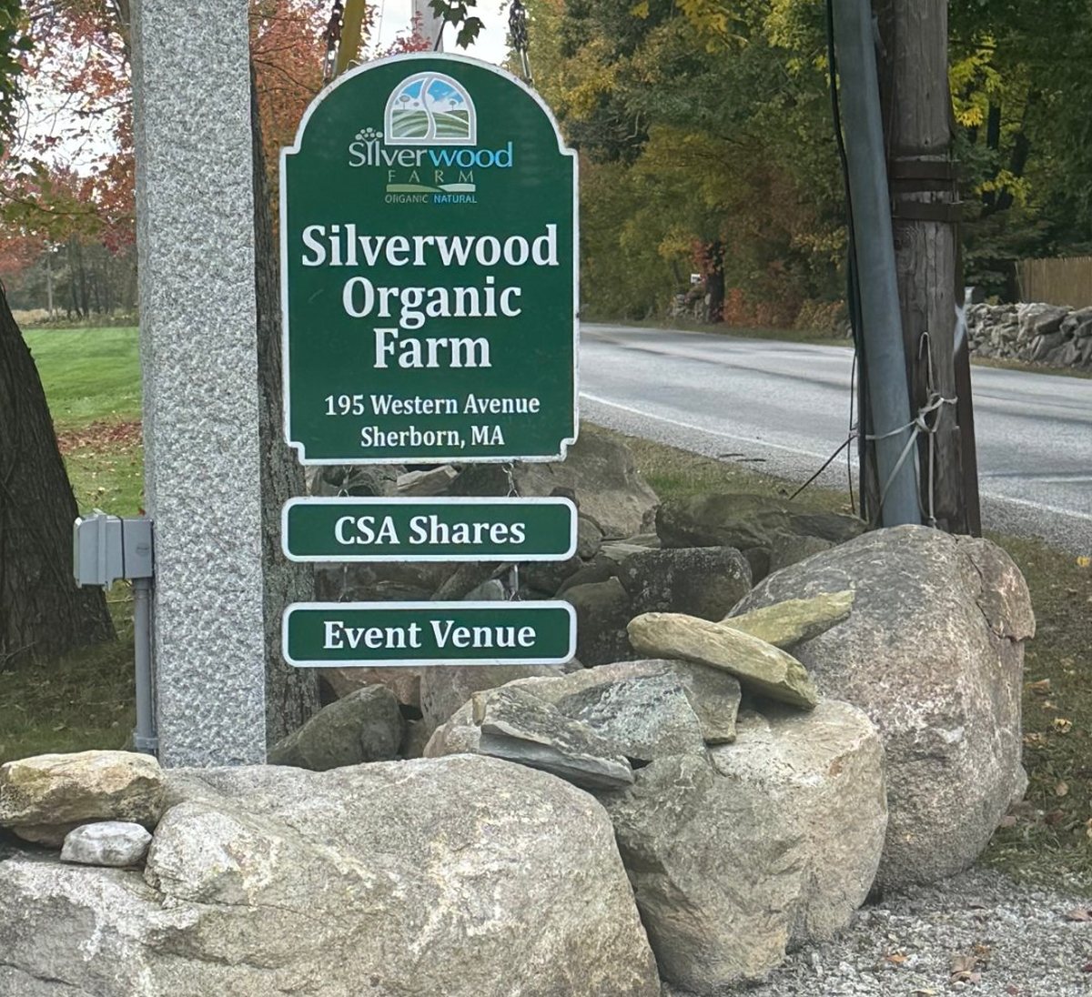 The Silverwood Organic Farm sign at 195 Western Avenue, with CSA Shares and Event Venue signs below