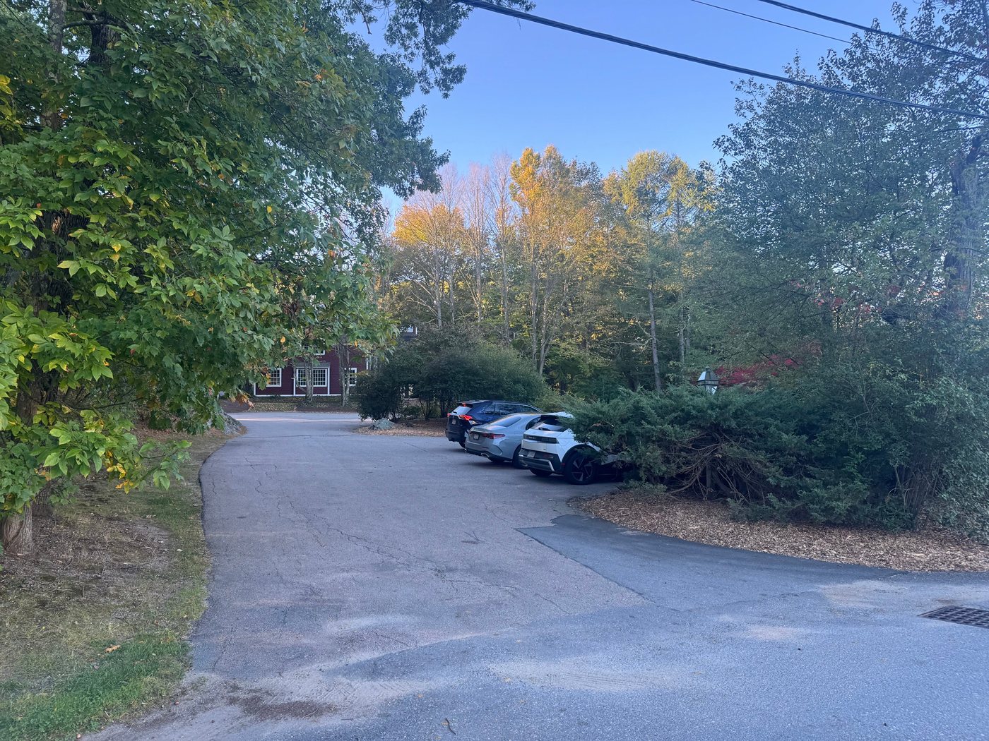 The paved parking lot off Cemetery Lane, across from the tennis courts and the fire station